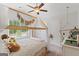 Bright bedroom features a wood canopy bed, plush carpet, and abundant natural light at 152 Creekrise Pl, Palmetto, GA 30268