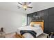 Stylish bedroom featuring a bed with Briggs throw, ceiling fan, and natural light at 152 Creekrise Pl, Palmetto, GA 30268