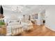 Spacious living room with coffered ceilings, hardwood floors, and stylish neutral furniture creates a relaxing space at 152 Creekrise Pl, Palmetto, GA 30268