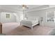 Spacious main bedroom with large bed, neutral colors, and tray ceiling at 152 Creekrise Pl, Palmetto, GA 30268