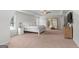 Large main bedroom featuring a bed, tray ceiling, and ensuite bath at 152 Creekrise Pl, Palmetto, GA 30268
