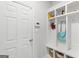 Organized mudroom features a built-in bench, coat hooks, and storage cubbies for convenience at 152 Creekrise Pl, Palmetto, GA 30268