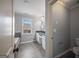 Bathroom with a large tub, white vanity, and gray tile flooring at 2548 Kickerillo Se Way, Atlanta, GA 30316
