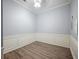 Neutrally painted room with wood-look flooring and base trim molding at 2548 Kickerillo Se Way, Atlanta, GA 30316