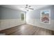 Bedroom with hardwood floors, large windows, and chair railing at 2548 Kickerillo Se Way, Atlanta, GA 30316