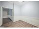 Well-lit room with hardwood floors, decorative trim, and ample space for versatile use at 2548 Kickerillo Se Way, Atlanta, GA 30316