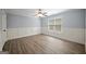 Light filled bedroom features hardwood floors, natural light, and chair rail at 2548 Kickerillo Se Way, Atlanta, GA 30316