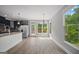 Dining room with stainless steel appliances, wood floors, natural light and access to the back deck at 2548 Kickerillo Se Way, Atlanta, GA 30316
