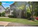 Charming home with mature trees, a covered porch, and a beautifully landscaped front yard at 2548 Kickerillo Se Way, Atlanta, GA 30316