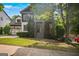 Charming home with mature trees, a covered porch, and a beautifully landscaped front yard at 2548 Kickerillo Se Way, Atlanta, GA 30316