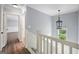 Bright hallway with natural light, hardwood floors, and stairs at 2548 Kickerillo Se Way, Atlanta, GA 30316