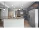 Kitchen island with granite countertops, stainless steel sink, and black cabinets at 2548 Kickerillo Se Way, Atlanta, GA 30316