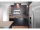 Kitchen featuring stainless steel appliances, black cabinets, and a granite countertop at 2548 Kickerillo Se Way, Atlanta, GA 30316