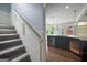 Partial kitchen view featuring a dark island with stainless steel appliances and granite counters at 2548 Kickerillo Se Way, Atlanta, GA 30316