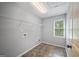 The laundry room has tile floors, natural light, and a shelving unit at 2548 Kickerillo Se Way, Atlanta, GA 30316
