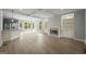 Open-concept living room features hardwood floors, coffered ceilings, fireplace and bright, natural light at 2548 Kickerillo Se Way, Atlanta, GA 30316