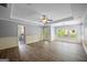 Bright living room featuring hard wood floors, chair railings, and a ceiling fan at 2548 Kickerillo Se Way, Atlanta, GA 30316