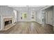 Bright and airy living area with wood floors, a fireplace, and plenty of natural light at 2548 Kickerillo Se Way, Atlanta, GA 30316