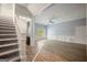 Open living room features hardwood floors, natural light, stairs and chair rail at 2548 Kickerillo Se Way, Atlanta, GA 30316