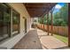 Covered outdoor patio with brick pavers, providing a cozy space for relaxation at 2548 Kickerillo Se Way, Atlanta, GA 30316