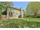 Exterior view of manicured yard, well-maintained lawn and mature trees surrounding home at 401 Waterwood Bnd, Peachtree City, GA 30269