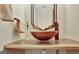 Close up of a modern bathroom sink with unique faucet and mirror at 401 Waterwood Bnd, Peachtree City, GA 30269