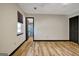 A well-lit bedroom boasting beautiful vinyl flooring, a window, and a doorway to the bathroom at 401 Waterwood Bnd, Peachtree City, GA 30269