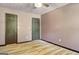 Neutral bedroom with modern lighting and wood-look flooring at 401 Waterwood Bnd, Peachtree City, GA 30269