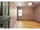 Spacious bedroom featuring wood-look flooring and a ceiling fan at 401 Waterwood Bnd, Peachtree City, GA 30269