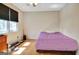 A bright bedroom featuring wood floors, a sunny window and ample space at 401 Waterwood Bnd, Peachtree City, GA 30269