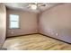 Bright bedroom featuring light-colored walls and modern lighting at 401 Waterwood Bnd, Peachtree City, GA 30269