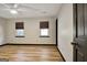 Spacious bedroom with hardwood floors, neutral paint and modern black trim at 401 Waterwood Bnd, Peachtree City, GA 30269