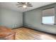 Cozy bedroom featuring wood-look floors and neutral paint at 401 Waterwood Bnd, Peachtree City, GA 30269
