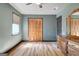 Neutral bedroom with wood-look flooring and closet space at 401 Waterwood Bnd, Peachtree City, GA 30269