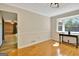Bright dining room with bay window, wood flooring, and elegant trim details at 401 Waterwood Bnd, Peachtree City, GA 30269