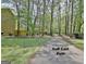 Wooded view of the golf cart path near the home, offering a scenic and convenient transportation option at 401 Waterwood Bnd, Peachtree City, GA 30269