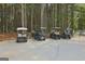 Conveniently parked golf carts surrounded by tall trees, offering easy transportation around the community at 401 Waterwood Bnd, Peachtree City, GA 30269