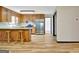 Well-lit kitchen equipped with stainless steel appliances, ample cabinets, and wooden flooring at 401 Waterwood Bnd, Peachtree City, GA 30269