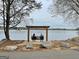 Scenic lakefront swing for two, offering a relaxing way to enjoy the serene water views and natural beauty at 401 Waterwood Bnd, Peachtree City, GA 30269