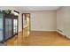 Open living room featuring wood floors, natural light, and neutral paint scheme at 401 Waterwood Bnd, Peachtree City, GA 30269
