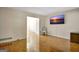 Bright living room with hardwood floors and a mounted flat screen TV at 401 Waterwood Bnd, Peachtree City, GA 30269