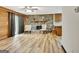 Spacious living room with wood floors, stone fireplace, and a door to the outside at 401 Waterwood Bnd, Peachtree City, GA 30269