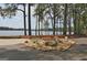 Charming entrance to Spyglass Island, a serene community amenity with lush landscaping and waterfront access at 401 Waterwood Bnd, Peachtree City, GA 30269