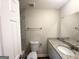 Bathroom features a granite vanity, sink, and toilet, plus marble shower tiles at 4397 Bluebird Ln, Lithia Springs, GA 30122