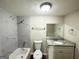 Updated bathroom featuring marble tile in shower and granite countertop at 4397 Bluebird Ln, Lithia Springs, GA 30122