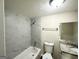 Updated bathroom featuring marble tile in shower and granite countertop at 4397 Bluebird Ln, Lithia Springs, GA 30122