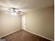 Bedroom with neutral paint, ceiling fan, and large closet at 4397 Bluebird Ln, Lithia Springs, GA 30122