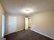 Bedroom showcasing neutral walls, new carpet, white trim, and doors at 4397 Bluebird Ln, Lithia Springs, GA 30122