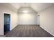 Spacious dining area features neutral carpet, a vaulted ceiling, and a view of the fenced backyard at 4397 Bluebird Ln, Lithia Springs, GA 30122