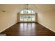 Bright and open living room with vaulted ceilings, expansive windows, and stylish flooring create a welcoming atmosphere at 4397 Bluebird Ln, Lithia Springs, GA 30122